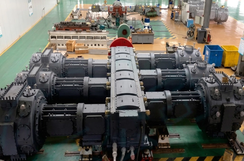 Detailed view of a massive 6-cylinder high-pressure oil-free compressor demonstrating extreme heavy-wall intercoolers and multi-stage cylinder configuration